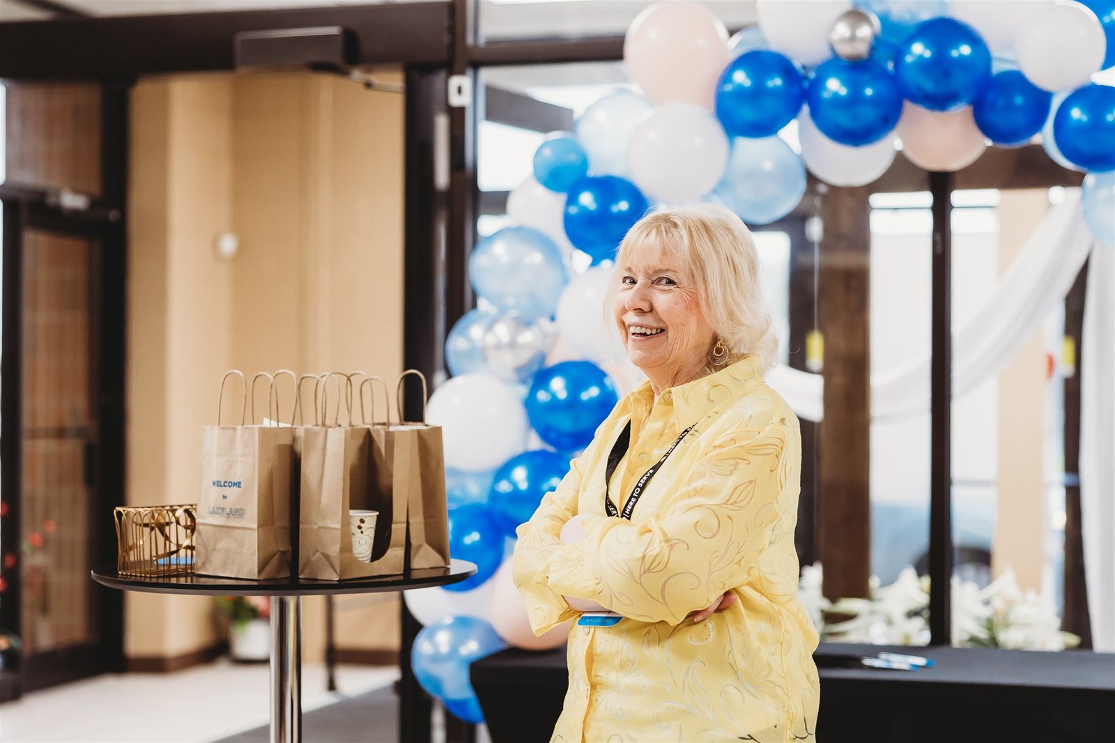 A photo of a volunteer greeting people